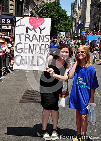 nyc-gay-pride-parade-mother-holding-sign-her-child-fifth-avenue-42075984.jpg