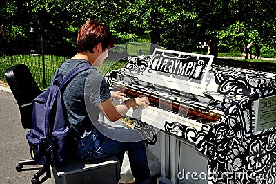 NYC: Young Man Playing Piano in Central Park