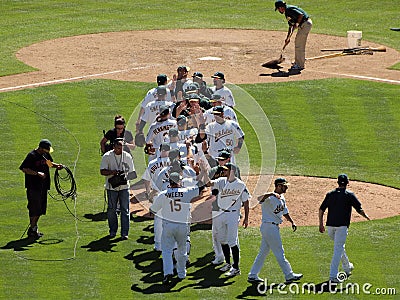 Oakland As celebrate a win at the end of a game