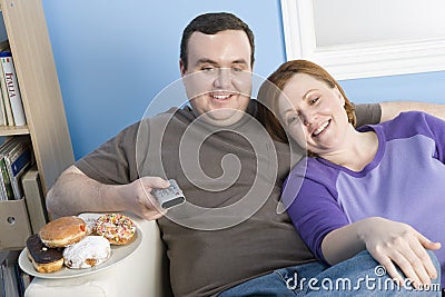 Obese Couple Watching Television