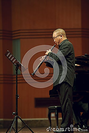 Oboist performs on wind music chamber music concert