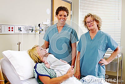 Obstetric nurses with Mom and newborn