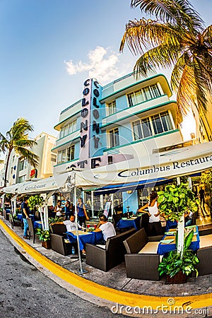 Ocean Drive in Miami with Restaurants in front of the famous Art Deco Style Colony Hotel