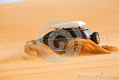 Off-road car fetching a dune, Libya - Africa