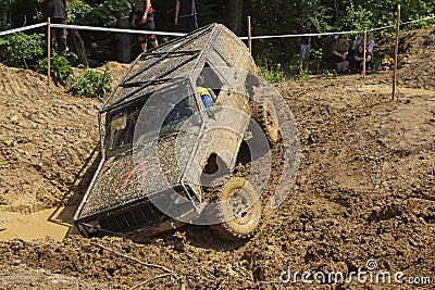 Off road car stuck in a muddy terrain