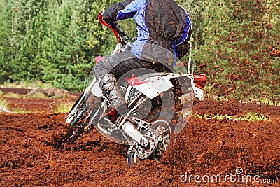 Off-road motorbike cornering in dirt