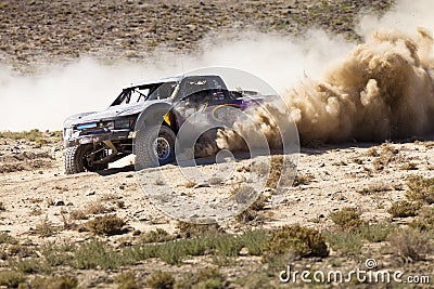 Off Road Truck Race with Dust Plume