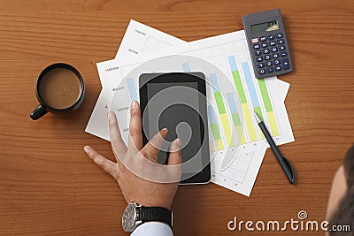 Offee on worktable covered with documents close up