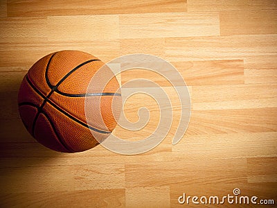 An official orange ball on a basketball court