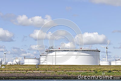 Oil depot with storage tanks and wind turbine