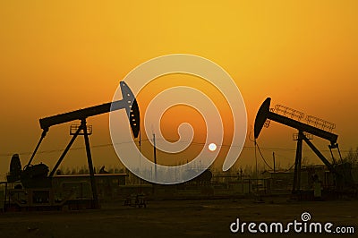 Oil pump against setting sun