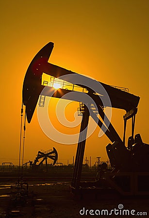 Oil pump against setting sun