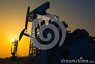 Oil pump against setting sun