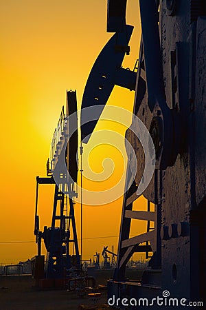 Oil pump against setting sun