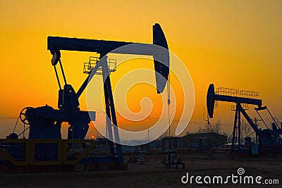 Oil pump against setting sun