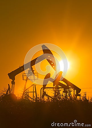 Oil pump against setting sun