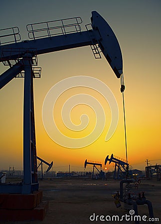 Oil pump against setting sun