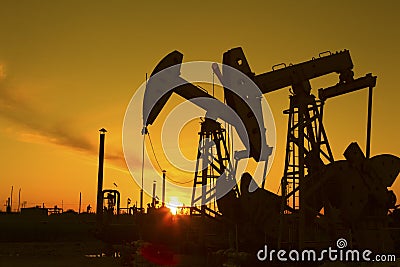 Oil pump against setting sun