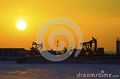 Oil pump against setting sun