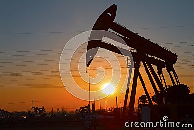 Oil pump against setting sun