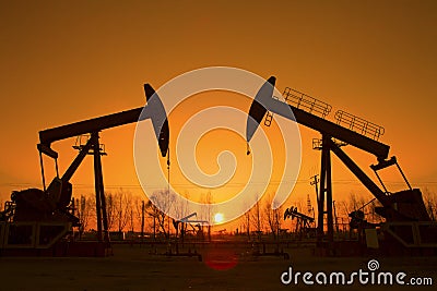 Oil pump against setting sun