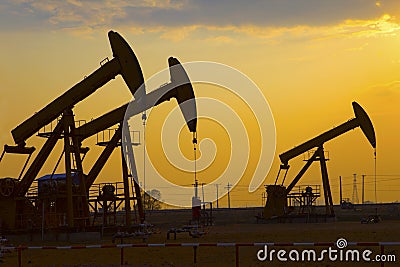 Oil pump against setting sun