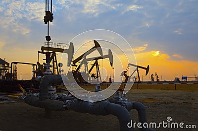 Oil pump against setting sun