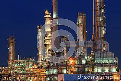 Oil refinery plant in petrochemical industry estate at night tim