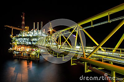 Oil rig at night with twilight background