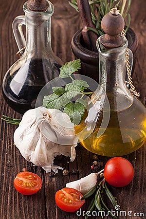 Oil and vinegar, gralic, tomatoes with herb