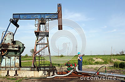 Oil worker works on pipeline