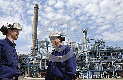 Oil workers and refinery