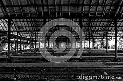 Old abandoned train station with rails