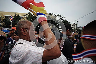 Old anti-government man blows whistle and raise Thai flag