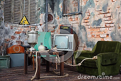 Old armchair, television, radio and table with samovar