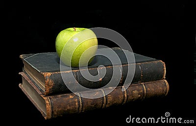 Old books and an apple