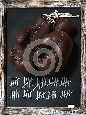 Old Boxing Gloves on Chalkboard with Tally Sheet