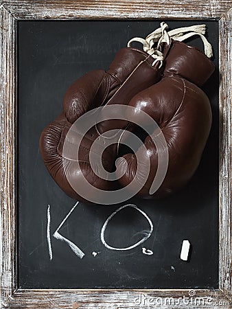 Old Boxing Gloves on Chalkboard with Text