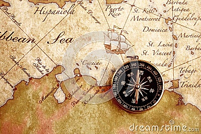 Old brass compass on a Treasure map