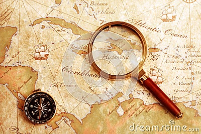 Old brass compass on a Treasure map