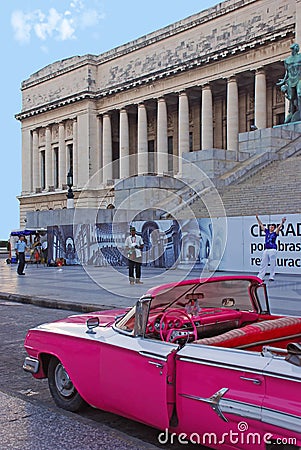 Old Bright Pink convertible Cuban Car in front of National Capitol Building