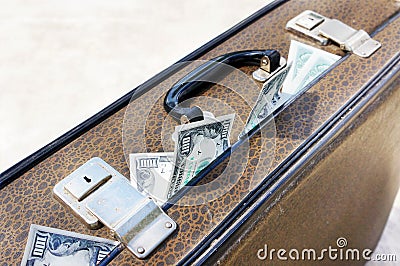 Old brown suitcase full of money
