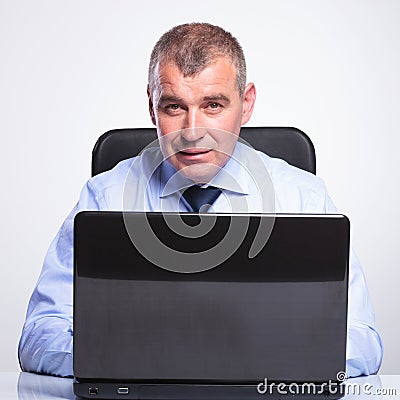 Old business man working at laptop