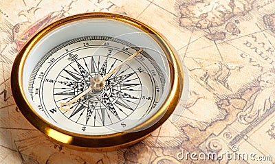 Old compass on ancient map