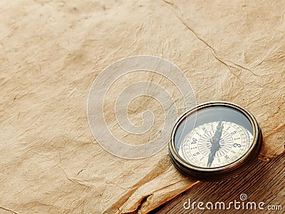Old compass on vintage background