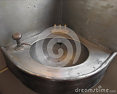 Old corner single metal sink.