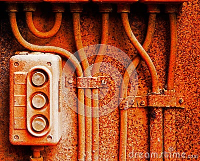 Old electric switch on rusty iron wall