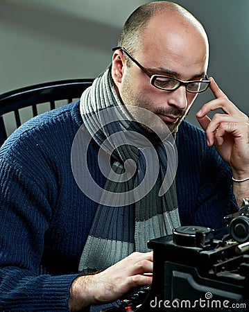 Old fashioned bald writer in glasses