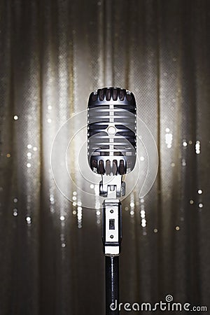 Old fashioned microphone in front of stage curtain