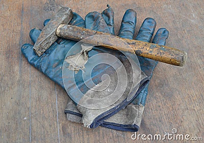 Old gloves and hammer